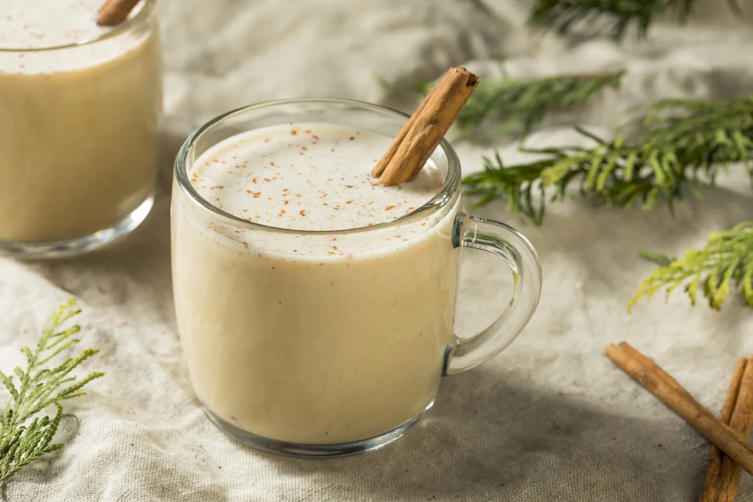 Coquito with cinnamon sticks