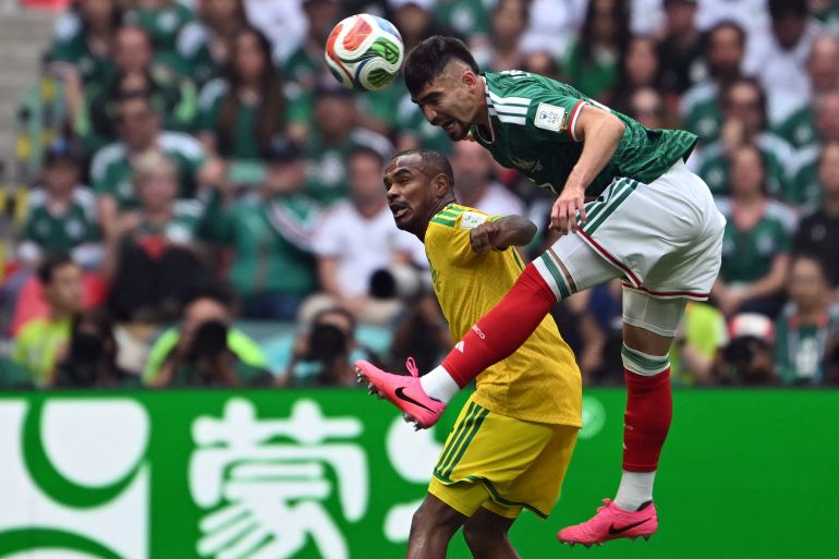 South Africa's forward #15 Iqraam Rayners and Mexico's defender #05 Johan Vasquez fight for the ball during the 2026 World Cup Group A football match between Mexico and South Africa at the Mexico City Stadium in Mexico City on June 11, 2026. (Photo by Yuri CORTEZ / AFP)