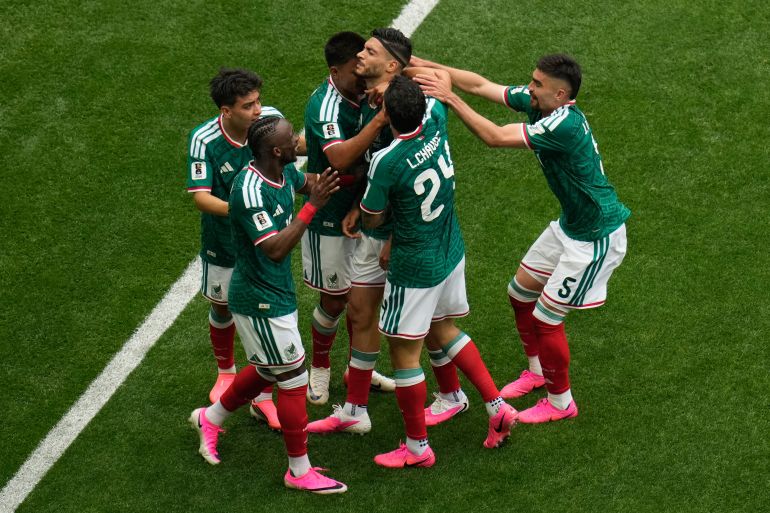 Mexico's Raul Jimenez celebrates with team mates after scoring his side's second goal during the World Cup Group A soccer match between Mexico and South Africa in Mexico City, Thursday, June 11, 2026. (AP Photo/Ricardo Mazalan)