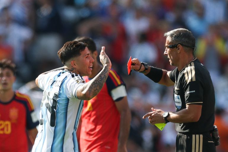 Slovenian referee Slavko Vincic shows a red card to Argentina's midfielder #24 Enzo Fernandez during the 2026 World Cup football tournament final match between Spain and Argentina at the New York/New Jersey Stadium in East Rutherford on July 19, 2026.