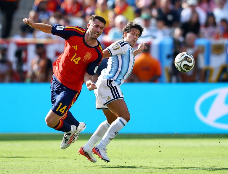 Soccer Football - FIFA World Cup 2026 - Final - Spain v Argentina - New York/New Jersey Stadium, East Rutherford, New Jersey, U.S. - July 19, 2026 Spain's Aymeric Laporte in action with Argentina's Giuliano Simeone REUTERS/Agustin Marcarian