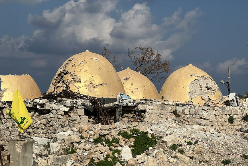 A Hezbollah flag is placed in front of the shrine of Shamoun al-Safa, built within a castle in the village of Shamaa in southern Lebanon's Tyre governorate, on January 31, 2025, that was heavily damaged by Israeli bombing. The hilltop castle houses the Muslim Shiite pilgrimage site over a tomb said by some to be that of Simon the Zealot, one of the 12 apostles of Jesus Christ, and by others of Simon, second son of the Biblical patriarch Jacob. (Photo by Mahmoud ZAYYAT / AFP) (Photo by MAHMOUD ZAYYAT/AFP via