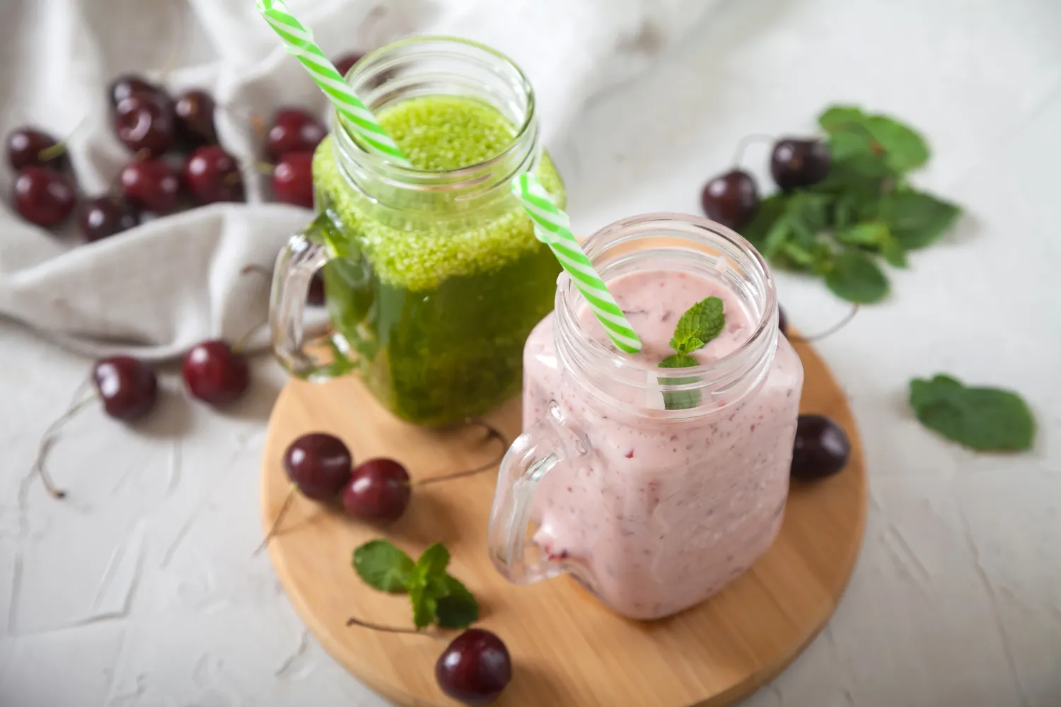 An image of leafy green and cherrie smoothies